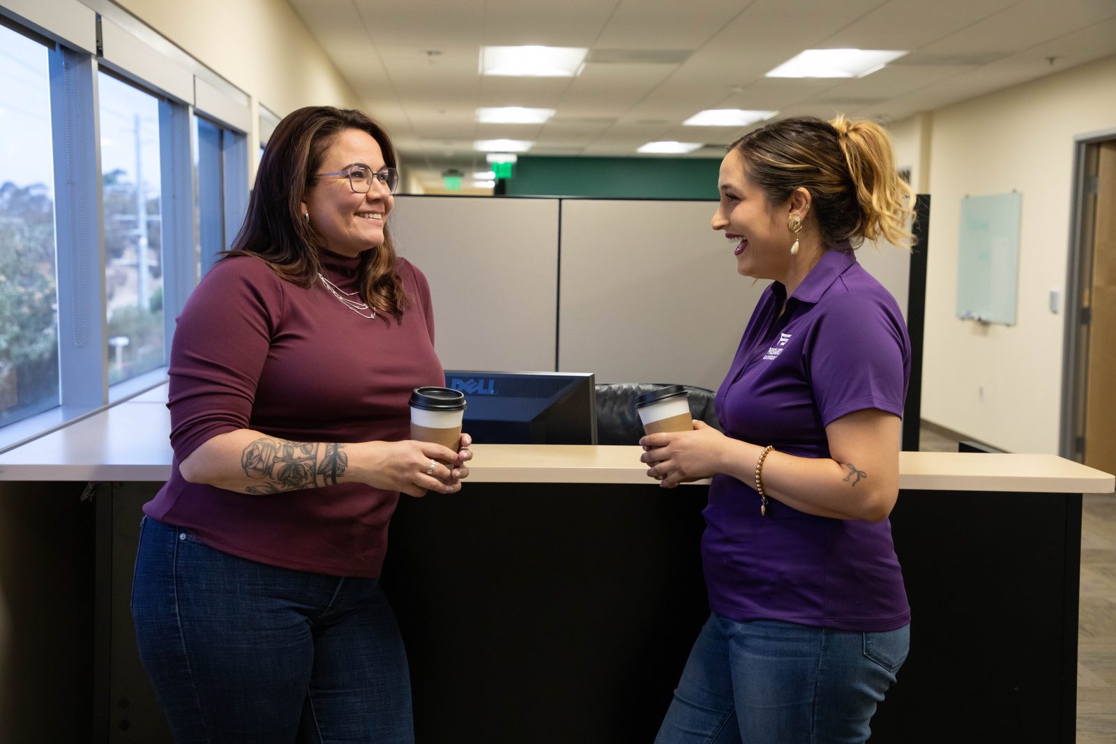 Two PSBI team members collaborating at work